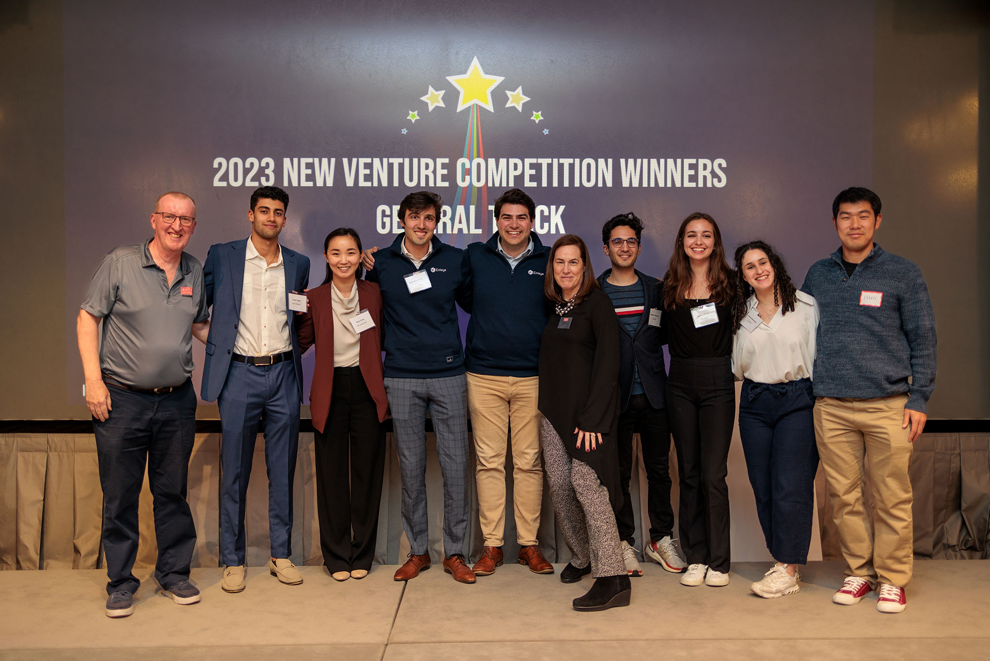 Photo: A group of people stand and pose for a photo in front of a sign that reads "2023 New Venture Competition Winners". Ian Mashiter, director of curriculum at Innovate@BU (from left), Johar Singh (Questrom’24), Shen Ning (MED’24), Stamatios Liapis (MED’23), Philippe Rival (Harvard Business School), Siobhan Dullea, executive director of Innovate@BU, Caspian Chaharom (CAS’23), Kelsey Mann (CFA’23), Chloe Adamowicz (CAS’23), and Harunobu Ishii (MET’22).