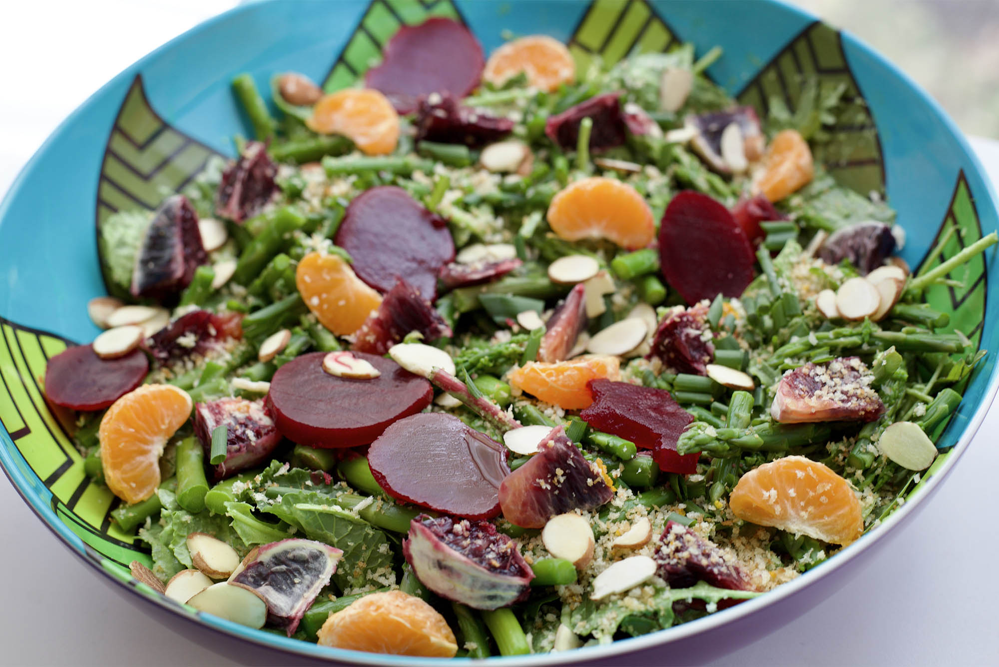Photo: Upclose picture of a spring salad with beats, nuts, lettuce, and more