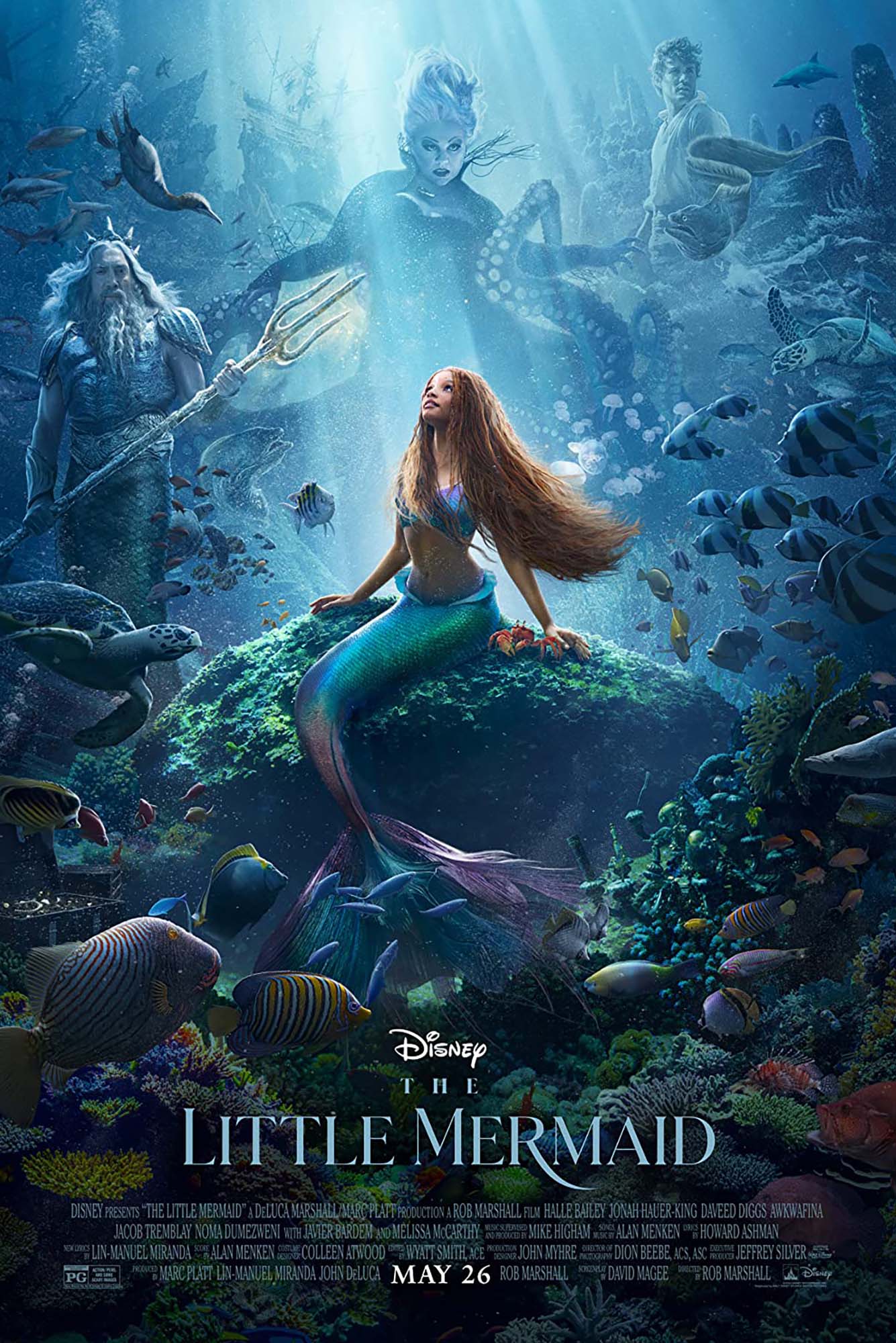 Photo: Movie poster for The Little Mermaid. Ariel with red long braids is looking up with a composite of Ursala behind her in the sea. Her father is to the left and Prince Eric is to the right.