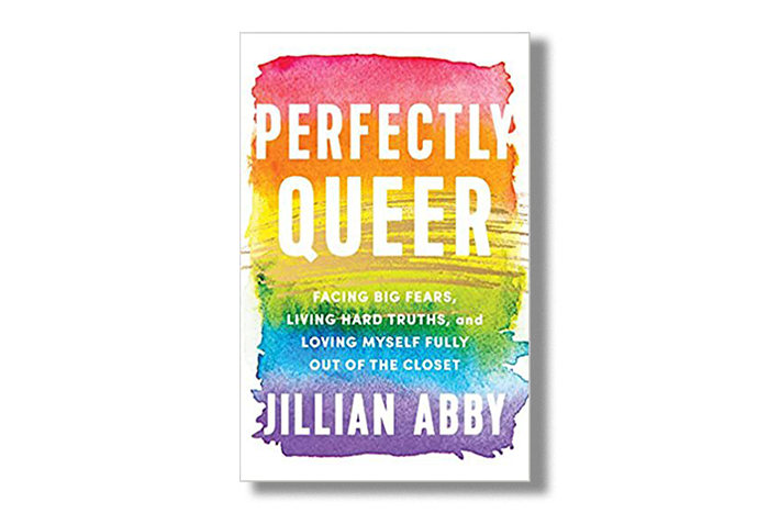 Cover of the book "Perfectly Queer" by Jillian Abby. A rainbow paint smear makes up the cover art of the book cover. Title and author are shown in bold white print on paint.