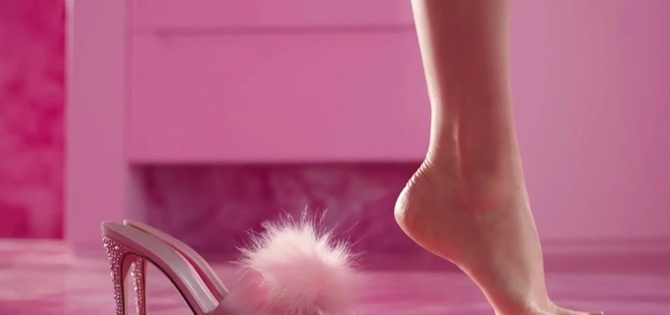 Photo: A screen grab of the shot where Barbie, played by Margo Robbie, steps out of her heels and her feet are still curved.