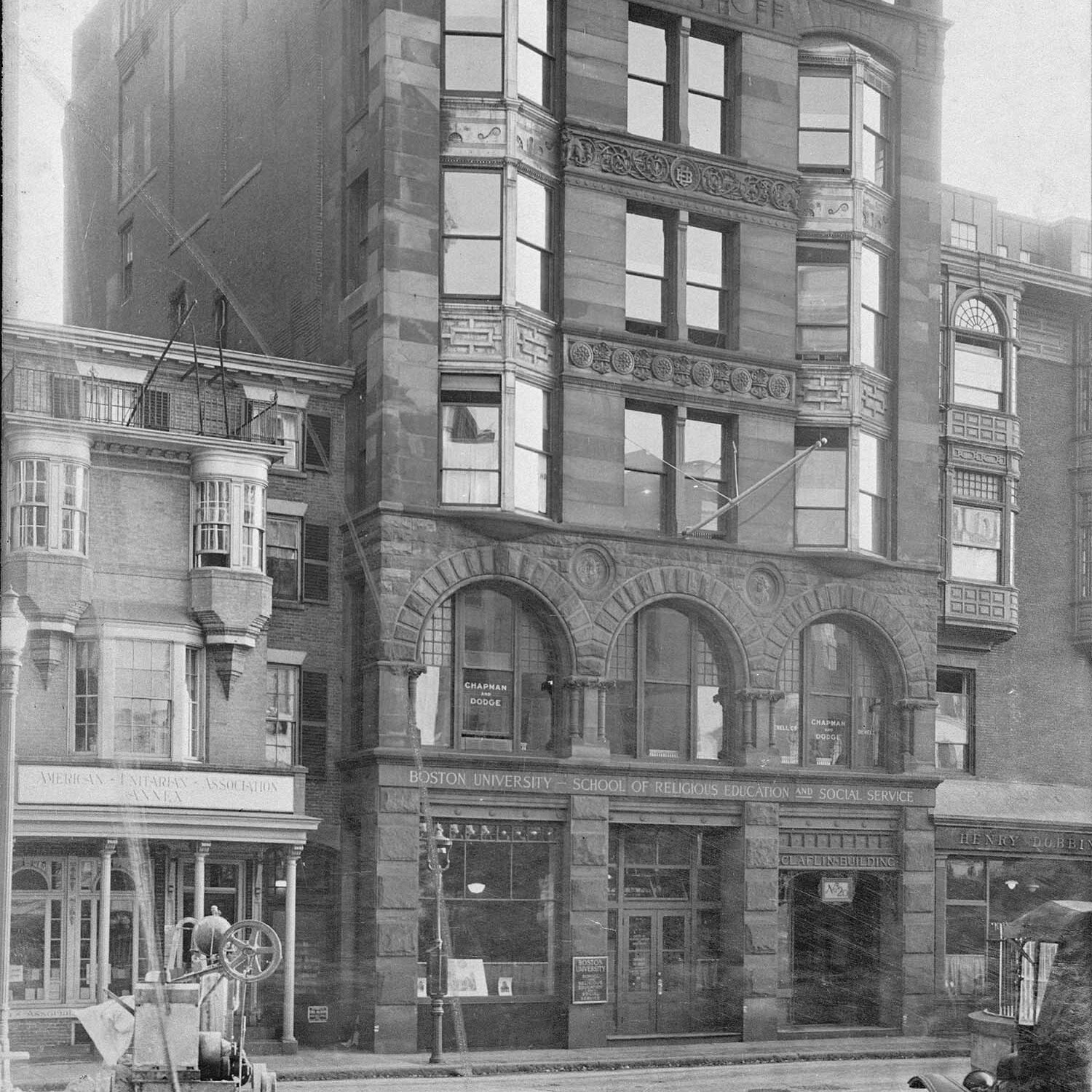 Black and White Photo: A large stone building in downtown Boston in the late 1800's