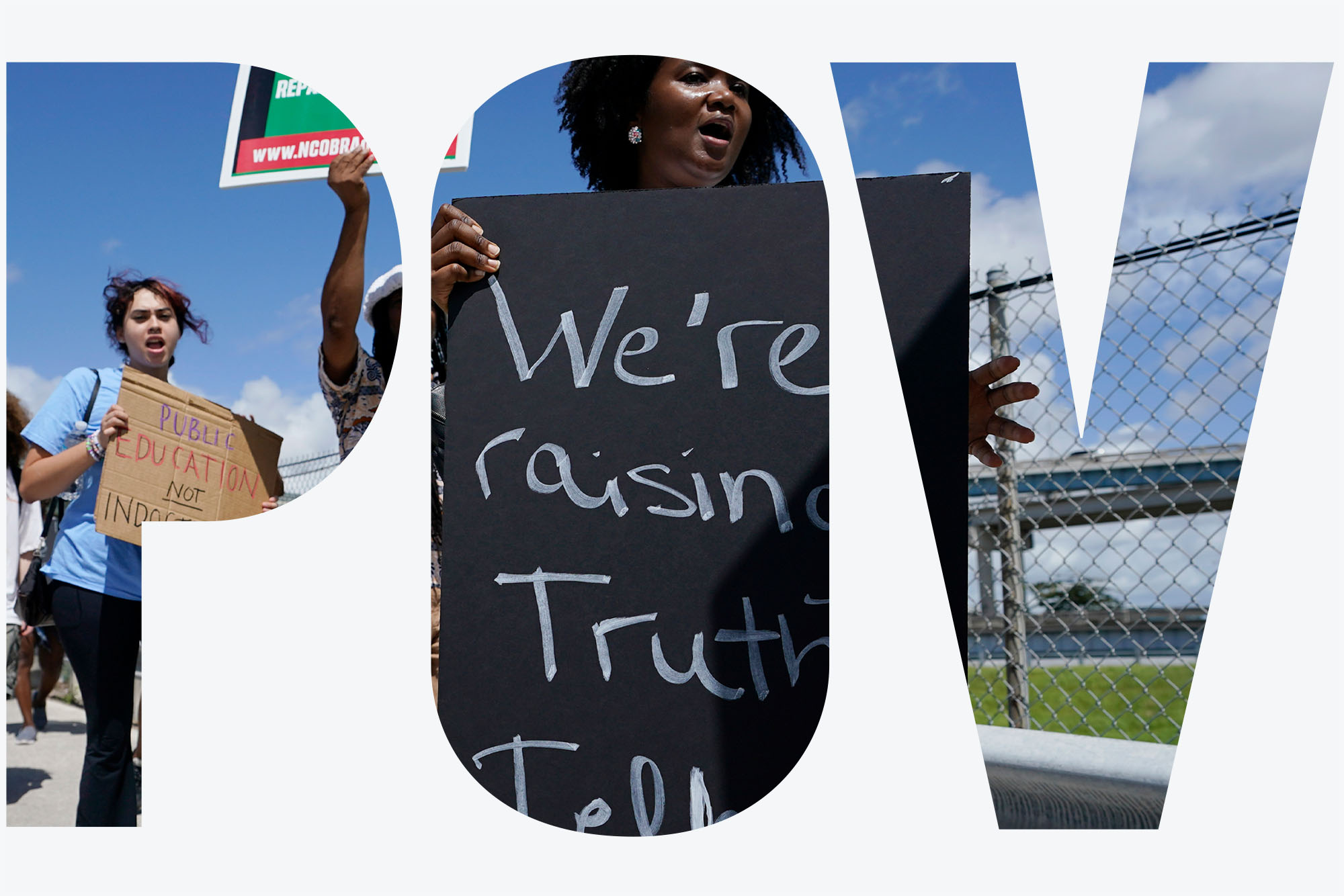 Photo: People carry signs during the "Teach No Lies" march to the School Board of Miami-Dade County to protest Florida's new standards for teaching Black history. A Black woman in the front holds a large black sign with the words "We're raising truth tellers!" in white chalk. Photo is seen through a white overlay with transparent letters that read "POV".