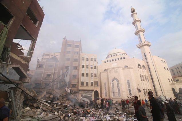 Photo: Palestinians inspect the damage of destroyed building after Israeli airstrikes in Khan Younis, Gaza Strip