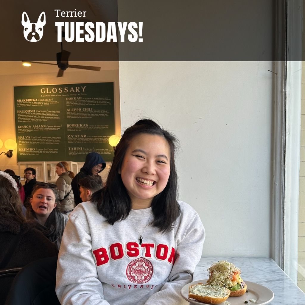 Photo: A young Asian woman wearing a white Boston University sweatshirt and smiles for the photo in a bright cafe. Overlay reads "Terrier Tuesdays!"