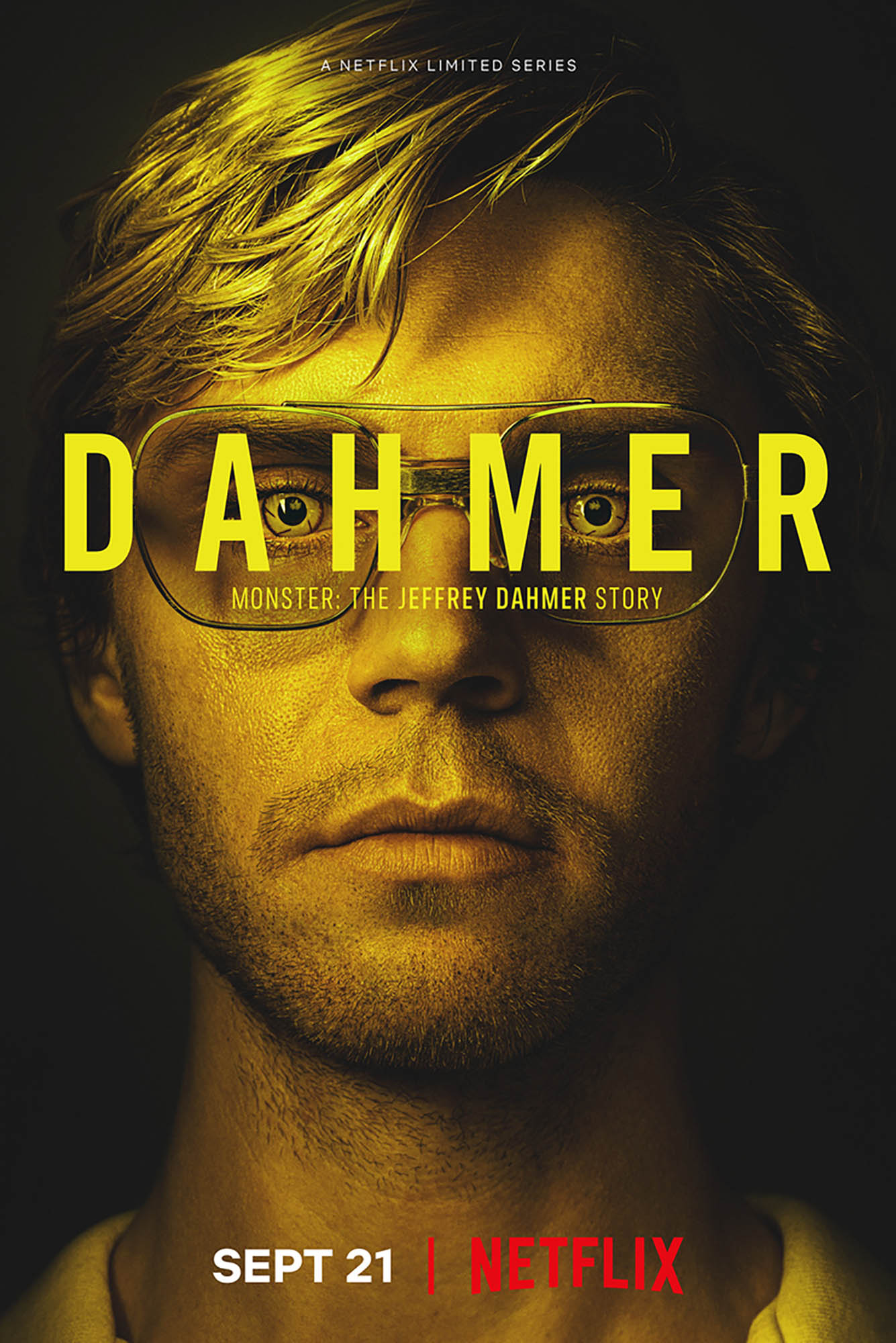 Photo: Promotional movie poster for the DAHMER series on Netflix. A headshot of the actor that plays Dahmer is behind yellow text overlay that reads DAHMER.
