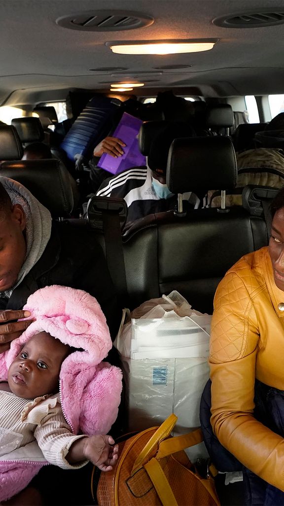 Photo: A family of immigrants in a car full of luggage in Boston, MA, heading for a shelter in Quincy MA