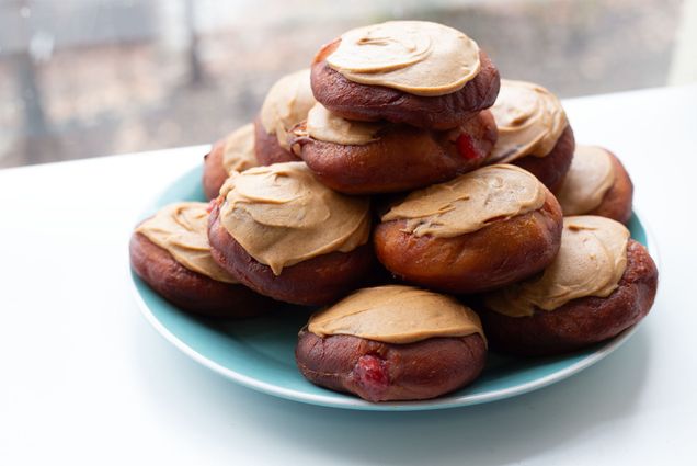 Photo: A plate of hanukkah jelly donuts (sufganiyot) covered with a peanut butter spread