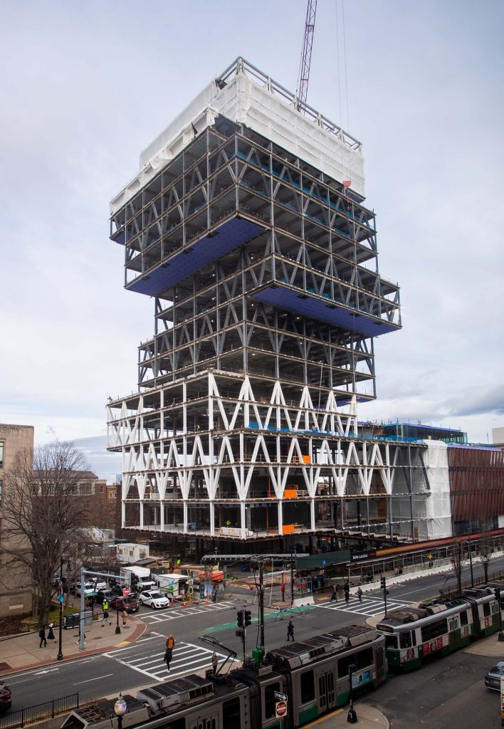 Photo of the data sciences building with the cantilevers removed taken November 30, as the stacked book look of the building begins to take shape.