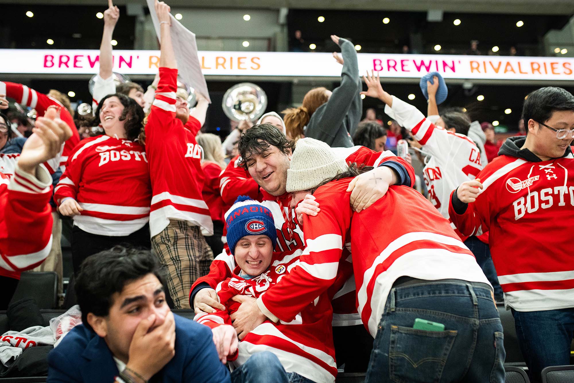 Photo: Fans dogpile in celebration after BU scores to bring the game into overtime during the 45th Women’s Beanpot Championship Round at TD Garden.