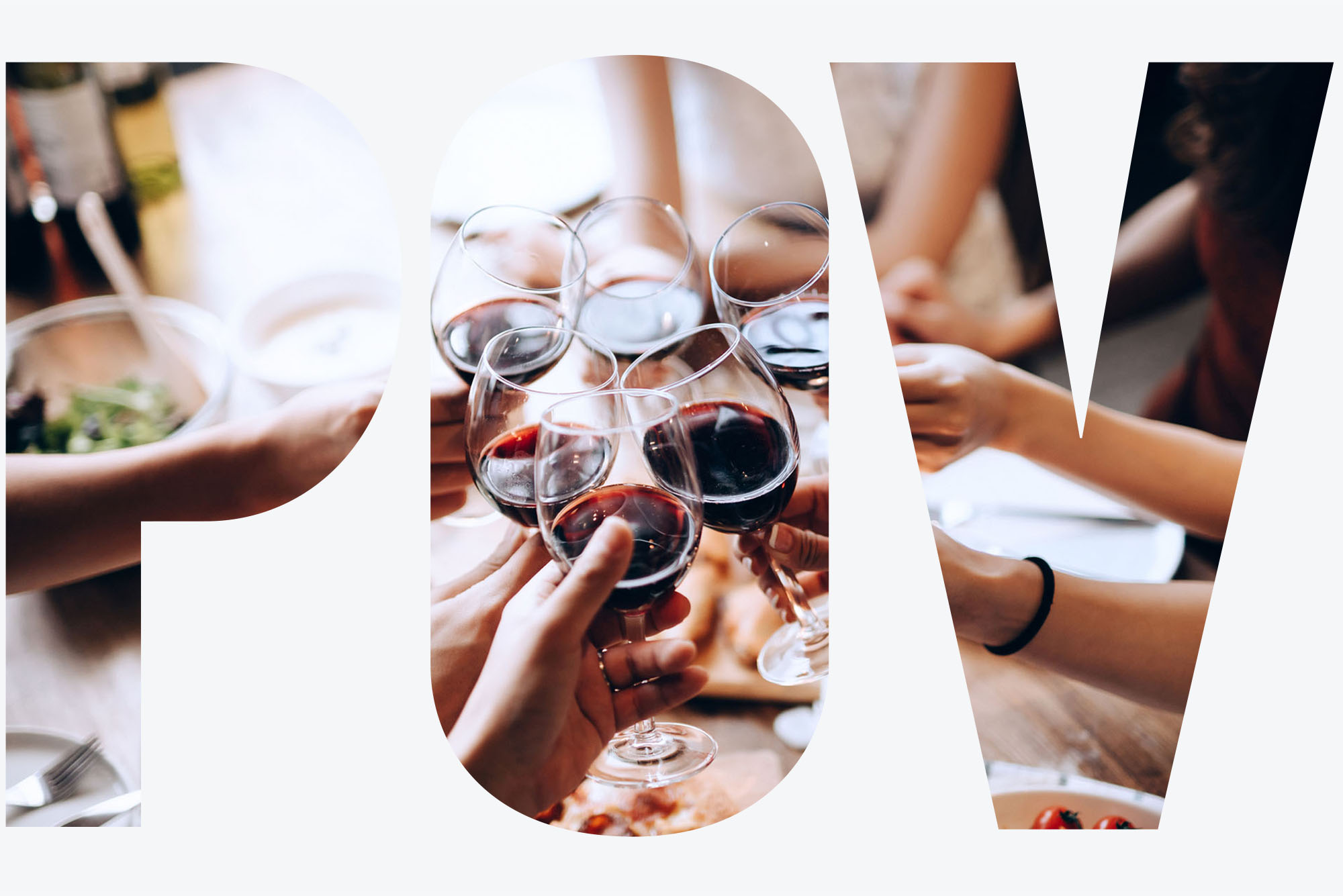 Photo: A group of people sitting at a table in a restaurant hold up their wine glasses for a toast. Text overlay reads "POV" in white