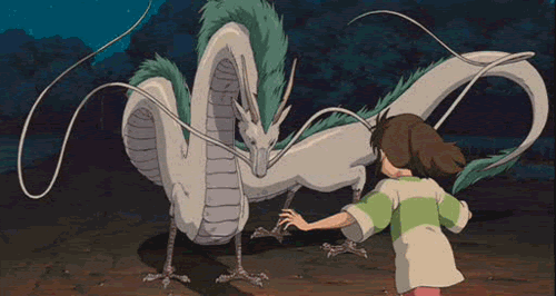 Gif from the movie "Spirited Away".  A child is running up to give the animated dragon a hug on the head. 