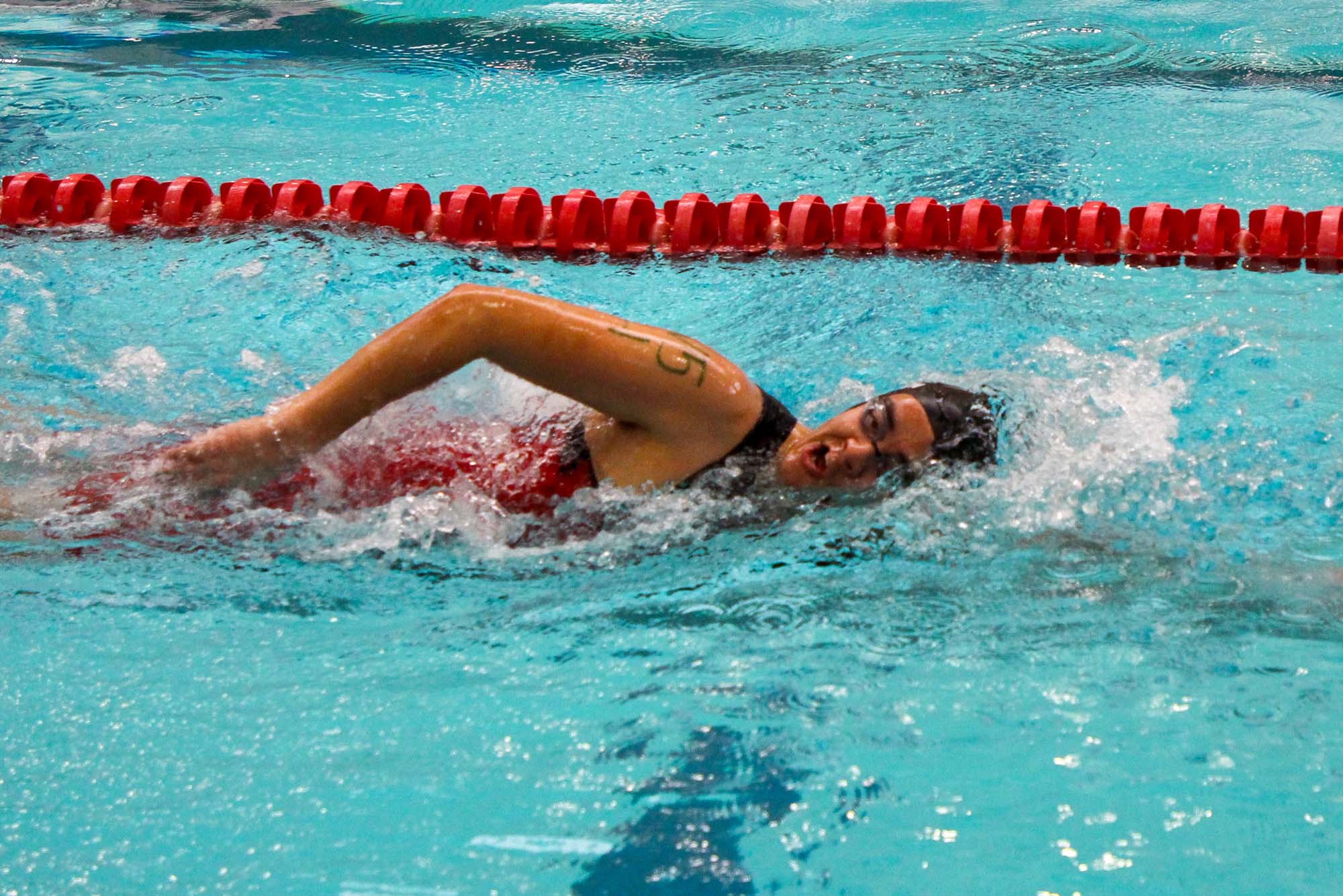 Photo: Colin Kunze (BU PhD Student, Biomedical Eng.) takes a breath as he glides through the water to complete the 250 yard swim for the Try-a-Tri, a mini triathlon hosted by BU's Triathlon Team Feb 17 sat FitRec.