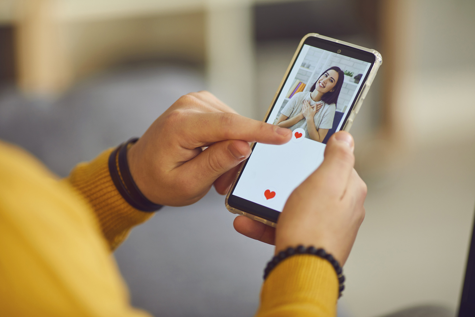 Photo: A stock image of a person swiping on a dating app on social media.