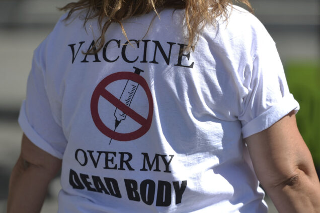 Photo: A stock image of A protester wearing a t-shirt with words 'Vaccine Over My Dead Body'. Protesters against vaccines, masks and the pandemic and their supporters seen in Capital Plaza outside the Federal Public Building during the 'Stand for Freedom, Justice and Truth' protest.