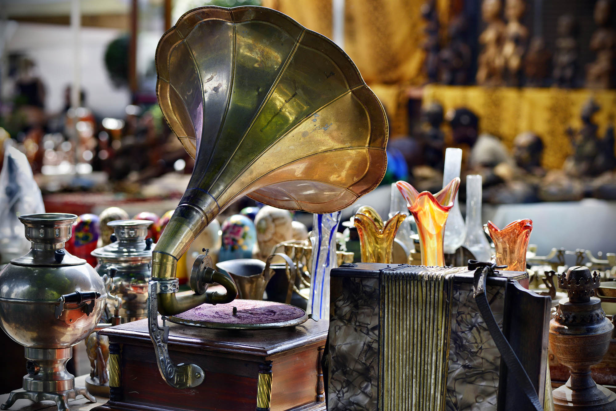 Photo: A stock image of a flea market with a huge megaphone device amongst the trinkets.