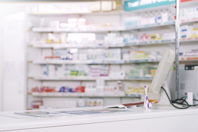 Photo: A stock shot a pharmacy, vacant of people. Shot of shelves stocked with various medicinal products in a pharmacy.