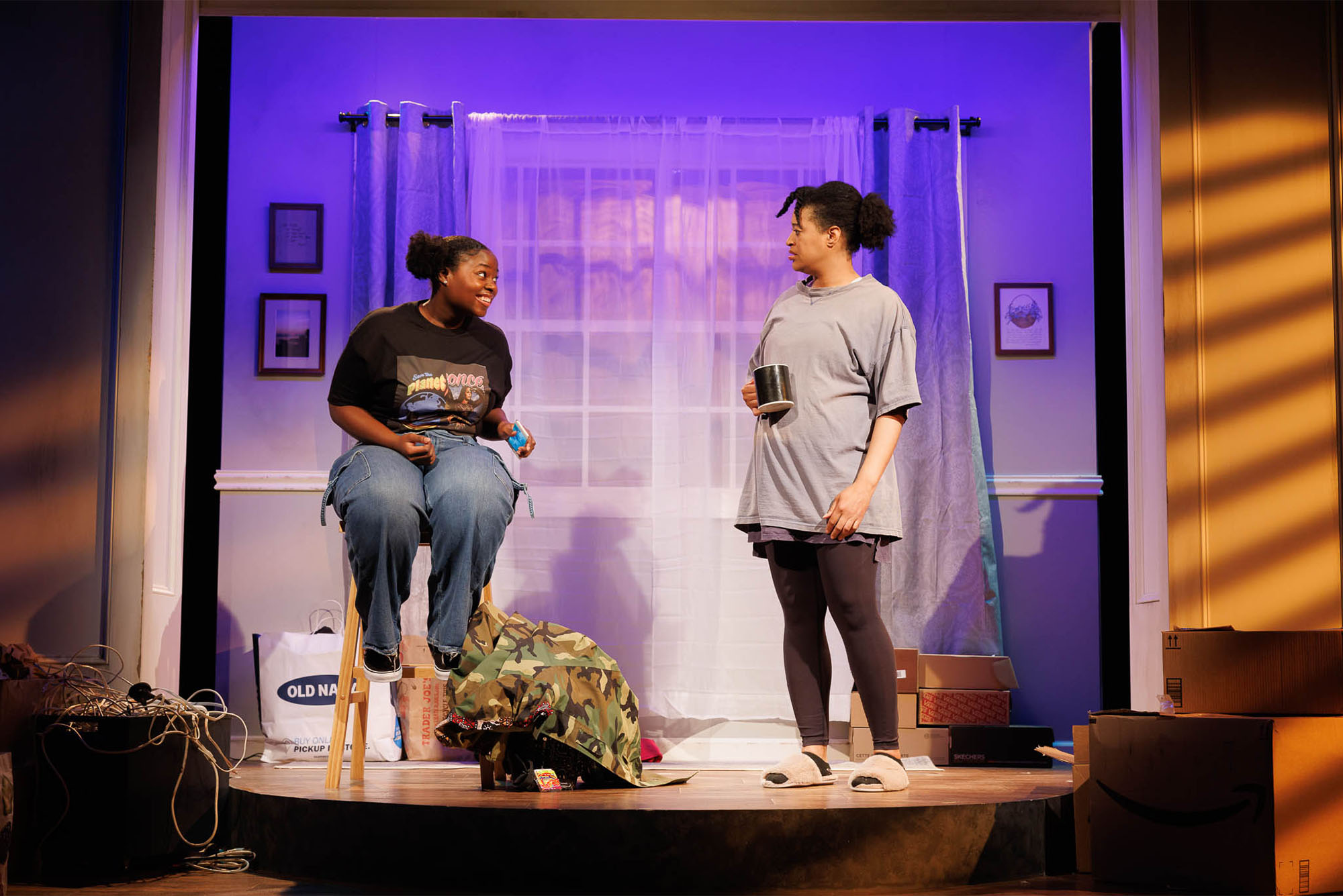 Jackson (left) and Kaili Y. Turner play Dailyn and Mia, a daughter and mother struggling to connect, in Kirsten Greenidge’s Morning, Noon, and Night, a Company One production with Boston University. Photo by Ken Yotsukura