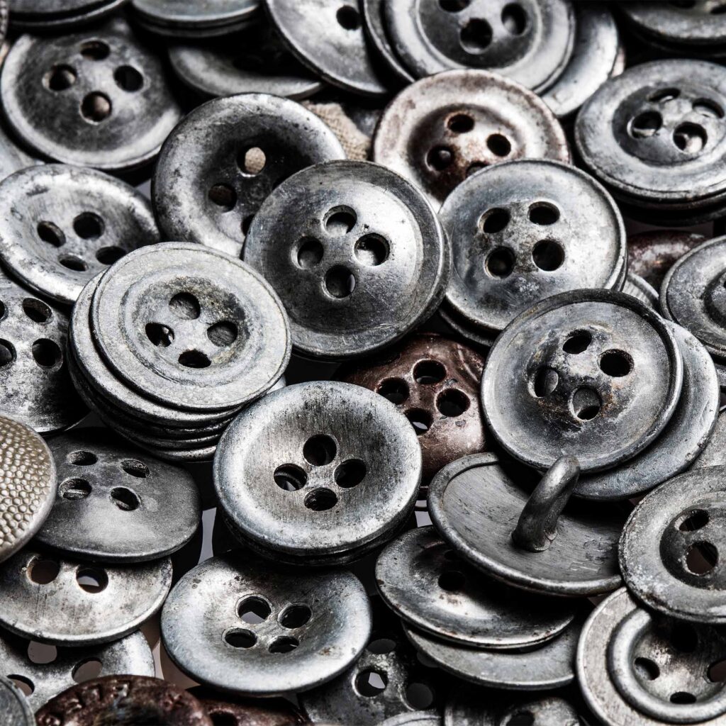 Photo: A large pile of buttons taken from a detainee at Auschwitz concentration camp