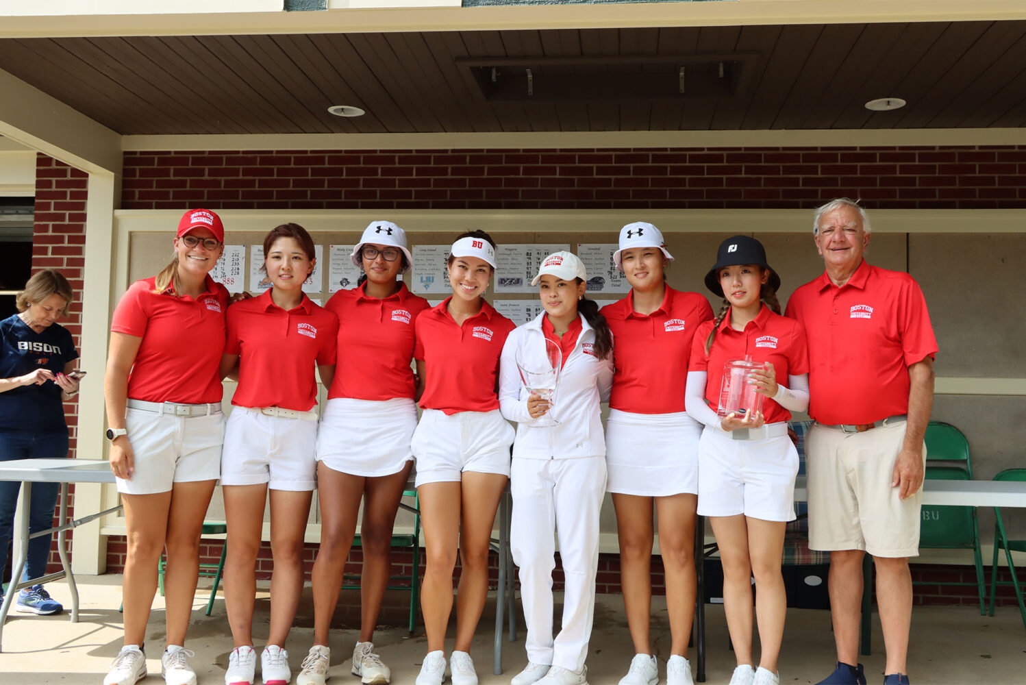 Members of the Boston University women’s golf team after capturing the Bucknell Invitational in Lewisburg, Pa., in September 2023. The Terriers will play the same course this weekend for the Patriot League championship. Pictured above: assistant coach Claire Edwards (left), Hibiki Adachi (CAS’27), Annika Manjunath (CAS’25), Madison Takai (Questrom’27), Victoria Takai (Questrom’25), Meiqi Gao (COM’25), Christy Chen (CAS’25) and head coach Bruce Chalas. Photo courtesy of Bucknell Athletics