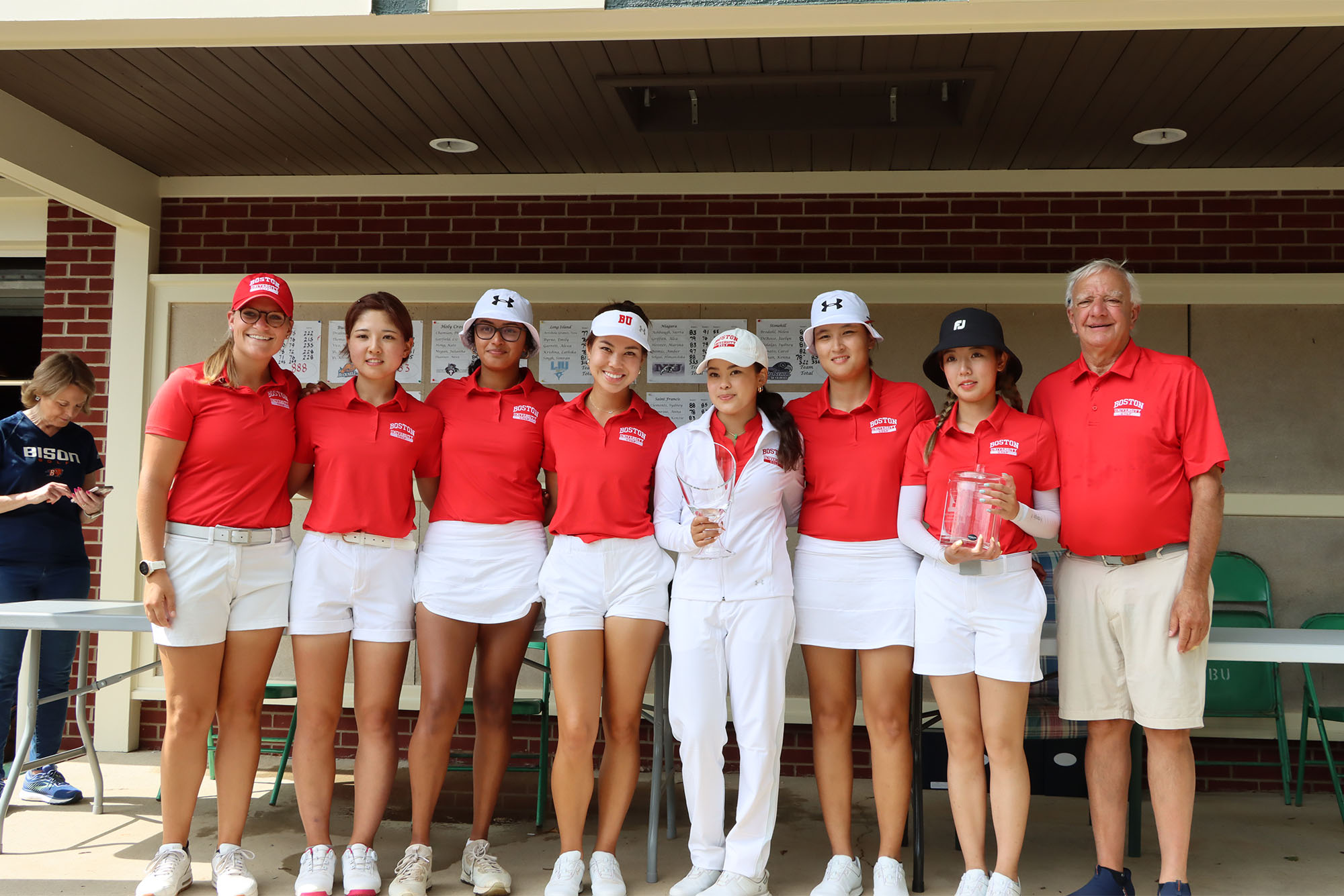 Members of the Boston University women’s golf team after capturing the Bucknell Invitational in Lewisburg, Pa., in September 2023. The Terriers will play the same course this weekend for the Patriot League championship. Pictured above: assistant coach Claire Edwards (left), Hibiki Adachi (CAS’27), Annika Manjunath (CAS’25), Madison Takai (Questrom’27), Victoria Takai (Questrom’25), Meiqi Gao (COM’25), Christy Chen (CAS’25) and head coach Bruce Chalas. Photo courtesy of Bucknell Athletics