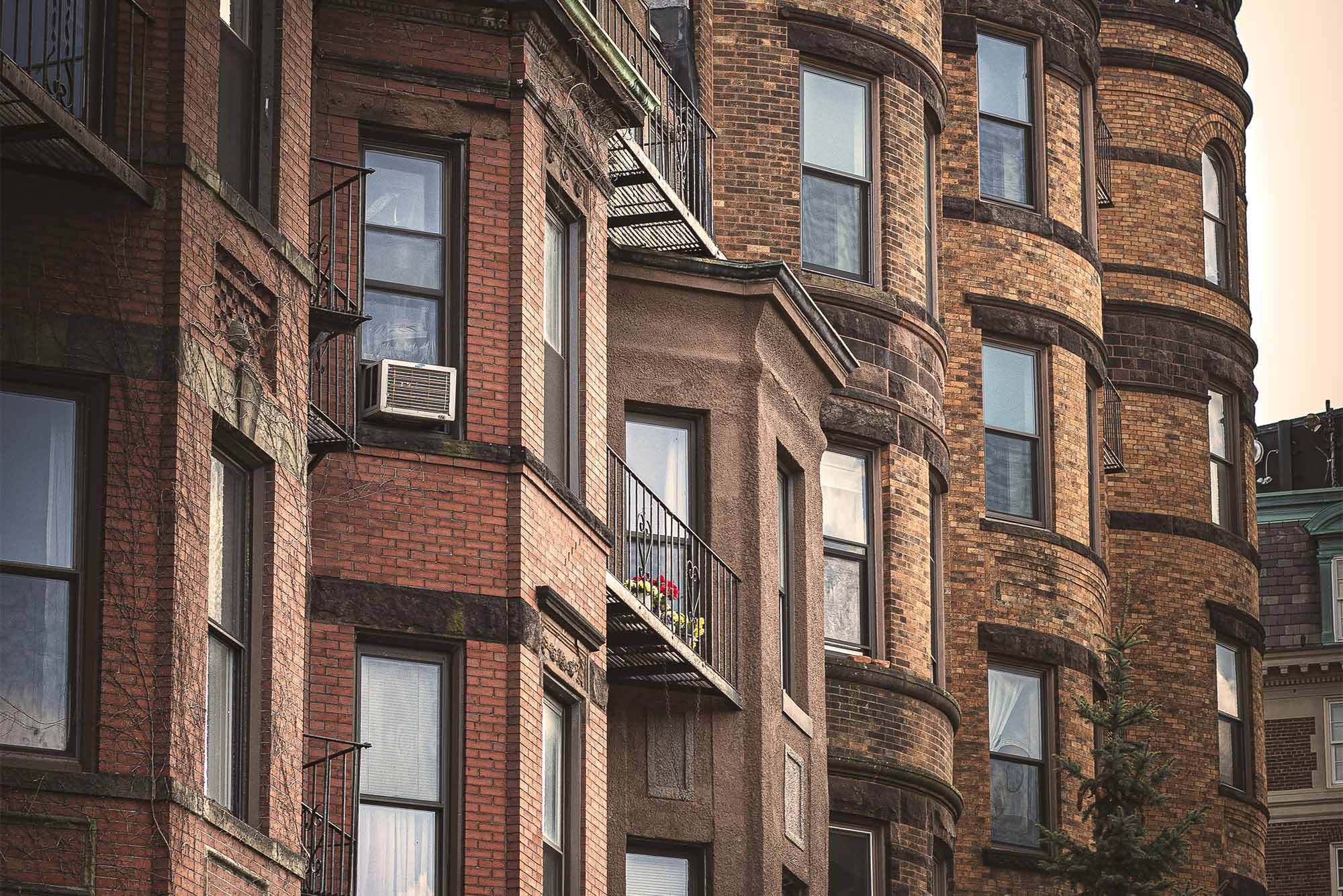 Photo: Brick apartment buildings in Boston on a sunny day