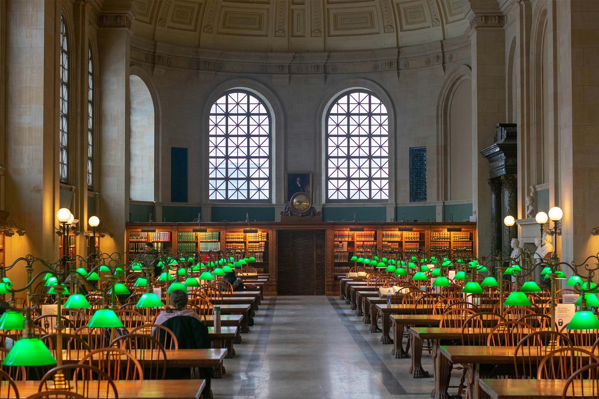 Photo: The inside of the Boston Public library, with ornate wood and stonework among large rows of seats