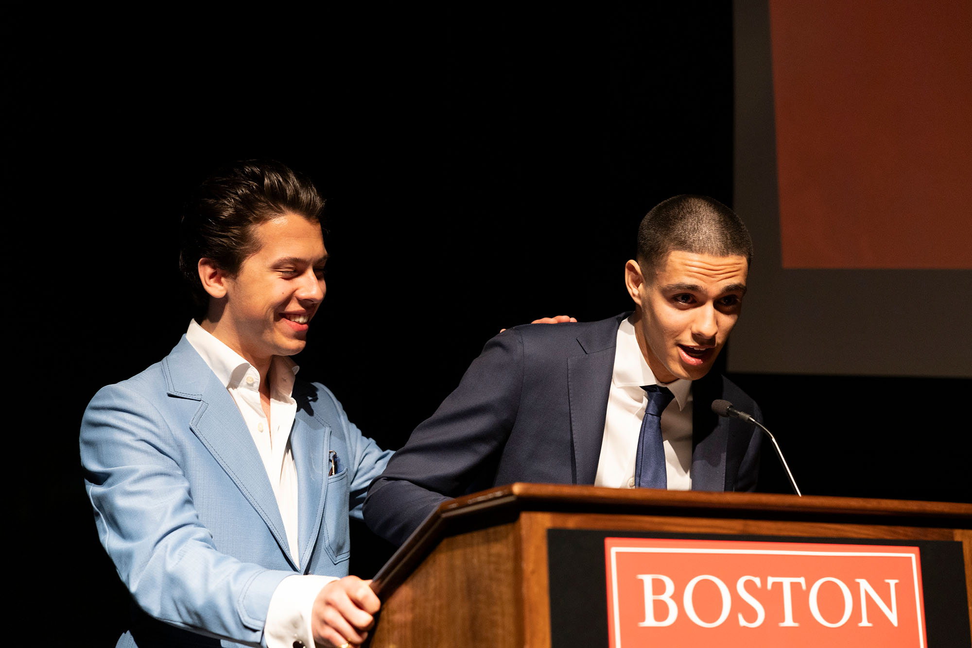 Photo: A picture of two men at a podium that says "Boston University"