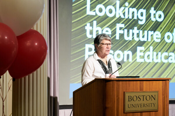 Photo: A picture of a woman speaking behind a podium that says "Boston University"