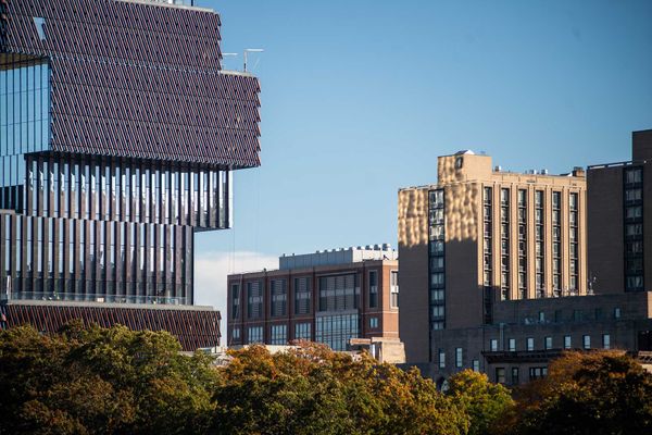 Photo: Light reflects of the Center for Computing and Data Science onto Warren Towers