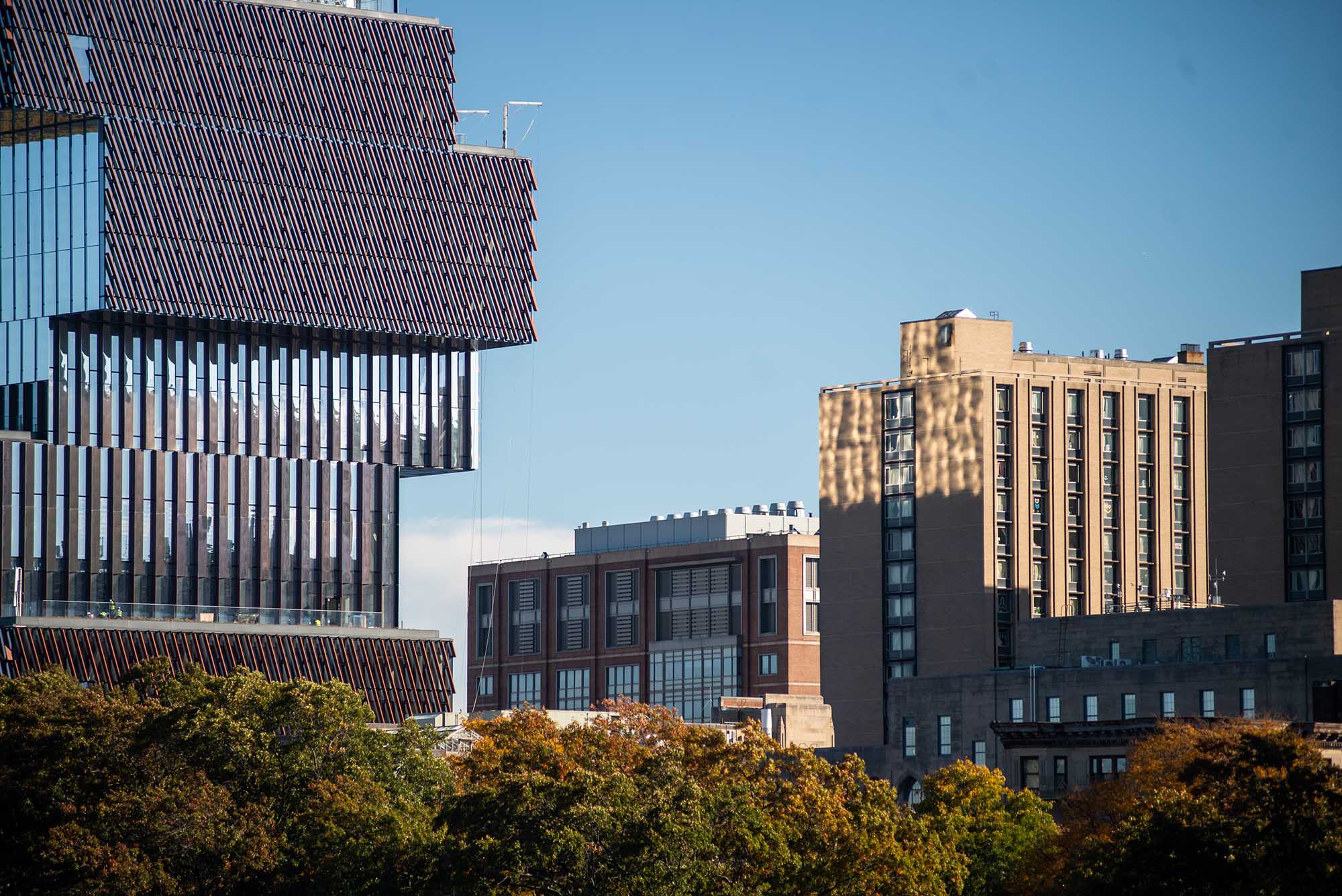 Photo: Light reflects of the Center for Computing and Data Science onto Warren Towers