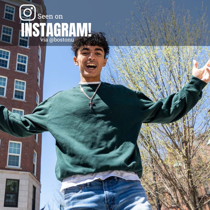 Photo: A picture of a man posing outside of a university dorm with his arms extended. He is wearing a green sweater with a white shirt under it and jeans. Text overlay reads "Seen on instagram via @bostonu"