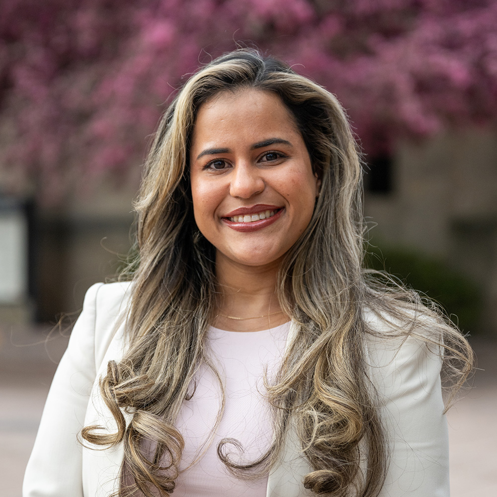 Photo: Ana Calderon (MET'24) for the professional student round up. She wears a tan blazer and a pink top and smiles for the photo.