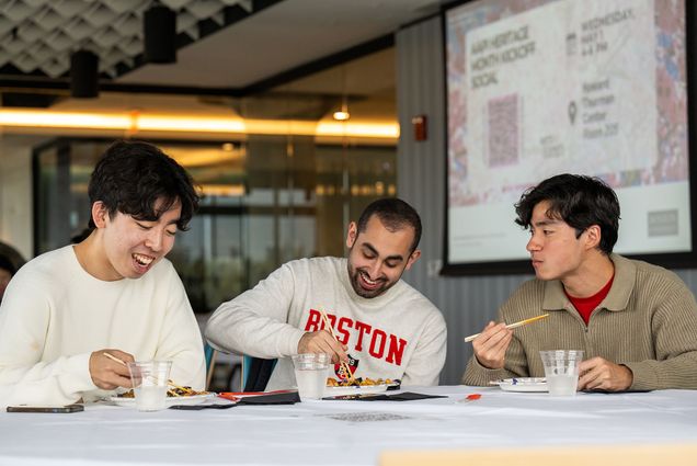 Photo: Sungmin Hwang (ENG’24), from left, Youssef Haider (ENG’24), and Aidan Chan (ENG’24) enjoy some Korean and Chinese cuisine ont he second floor of HTC May 1.