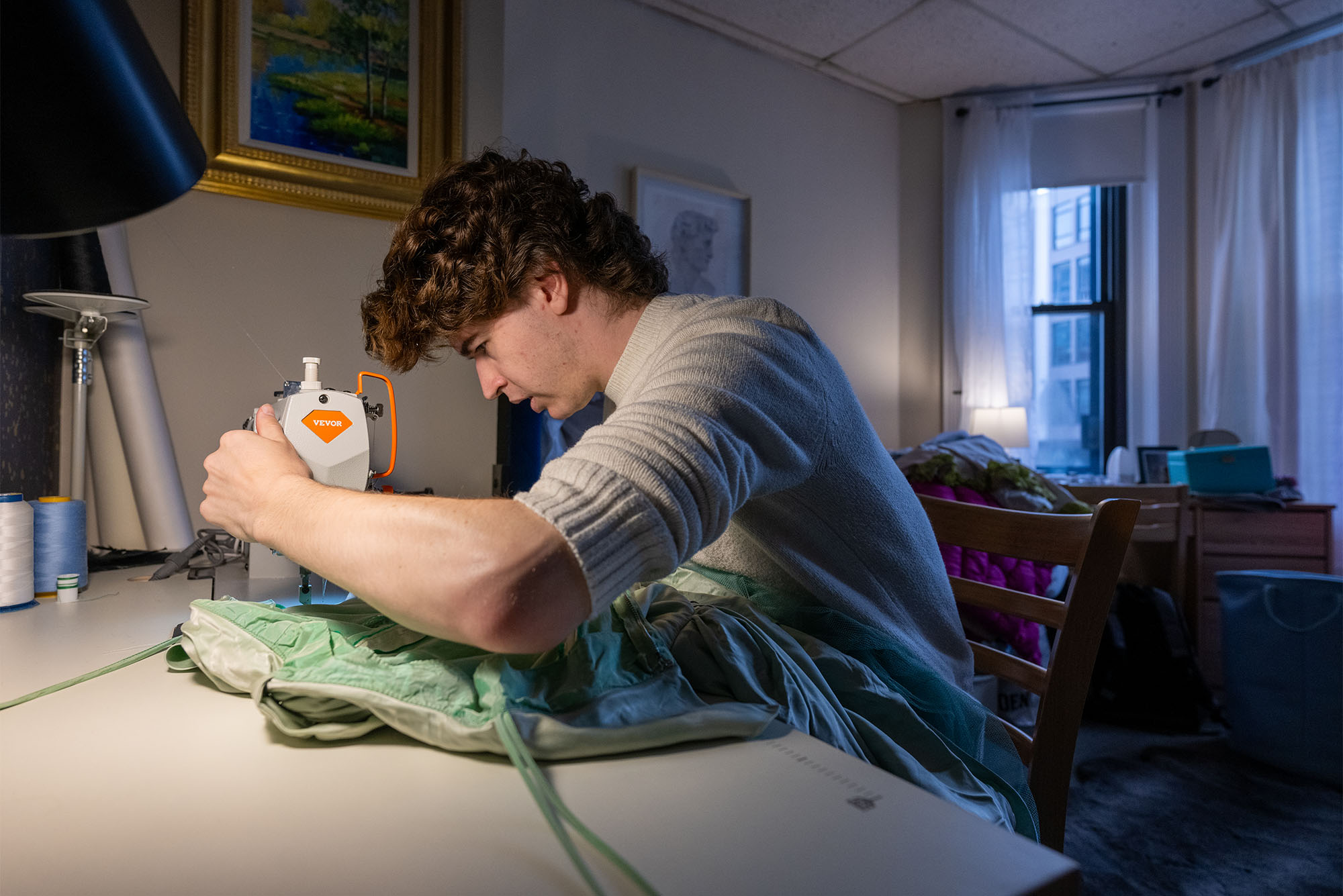 Photo: Hutton brings his works in progress and sewing materials to campus at the start of each school year and transports them home in the summer. Photo by Cydney Scott