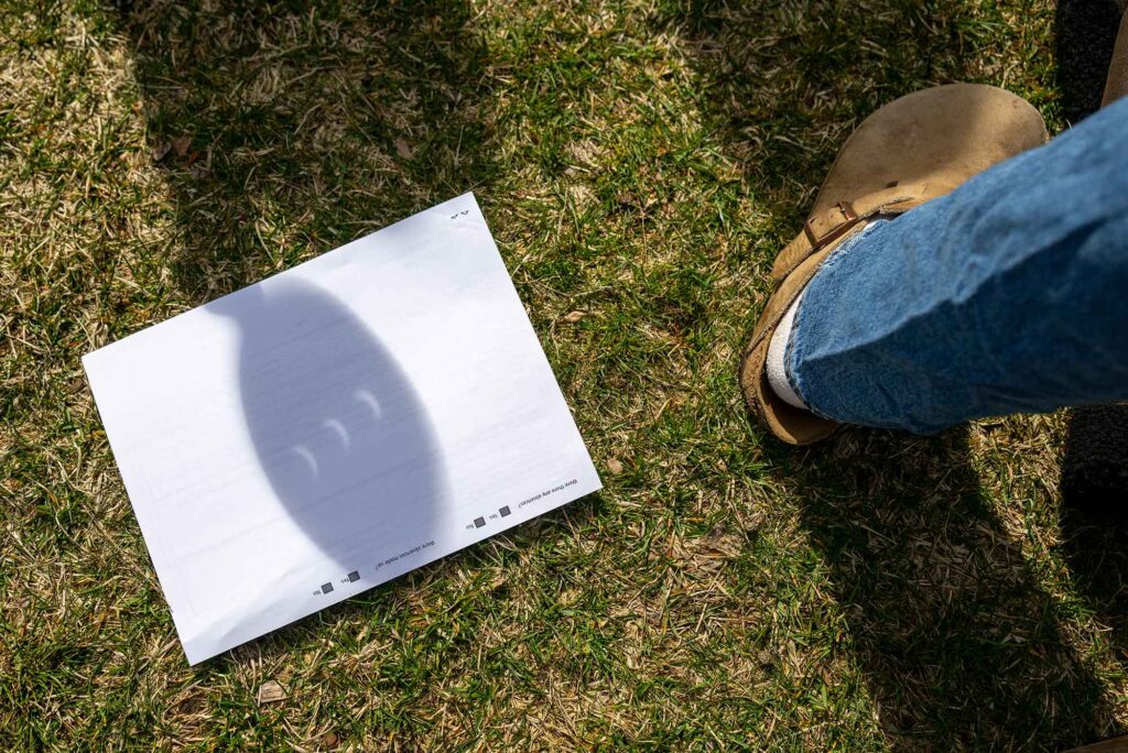 Photo: A picture of the shape of the sun during an eclipse reflected on a piece of paper