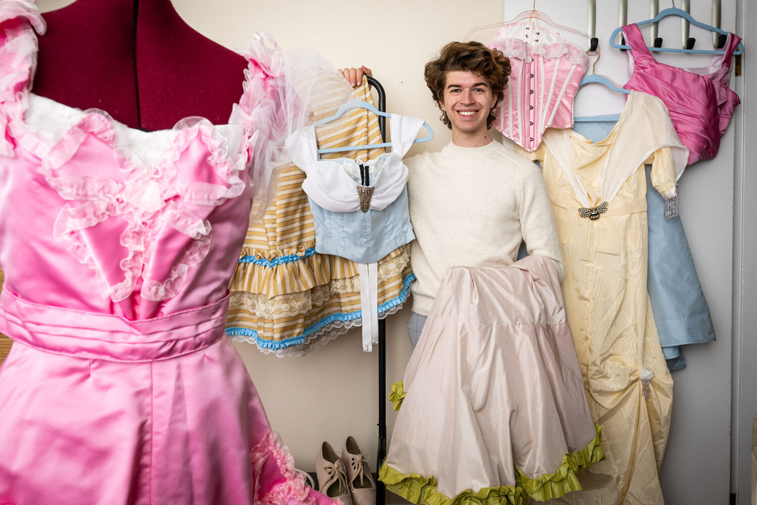 Photo: Shaw Hutton (CGS'23, CAS'25), an architectural studies major, spends his spare time making reproductions of 19th and early 20th century women's fashions. Photo by Cydney Scott for Boston University Photography