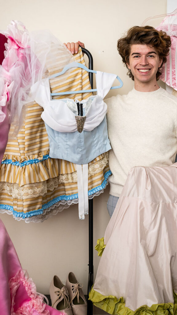 Photo: Shaw Hutton (CGS'23, CAS'25), an architectural studies major, spends his spare time making reproductions of 19th and early 20th century women's fashions. Photo by Cydney Scott for Boston University Photography