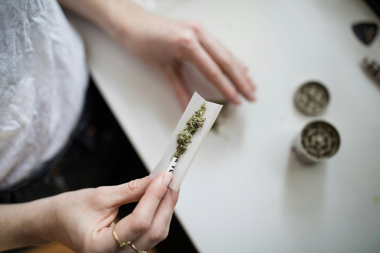 Photo: A stock image of an individual rolling up a joint.