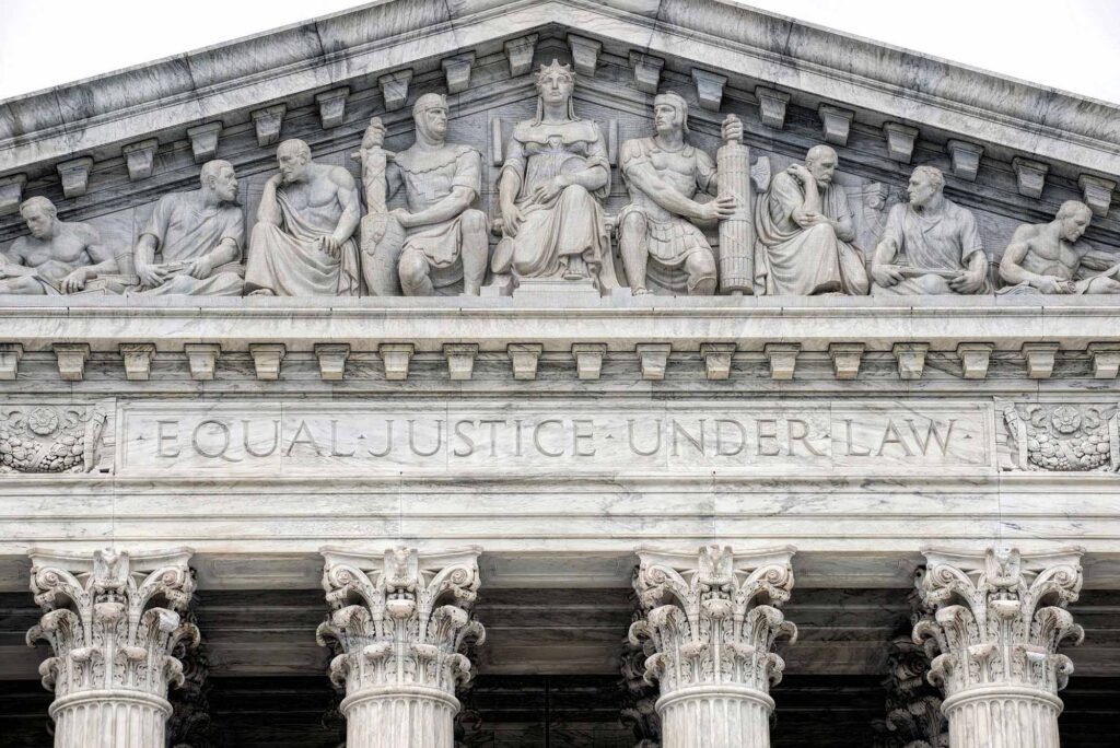 Photo: A picture of the words "Equal Justice Under Law" with carvings on the entrance of the Supreme Court building