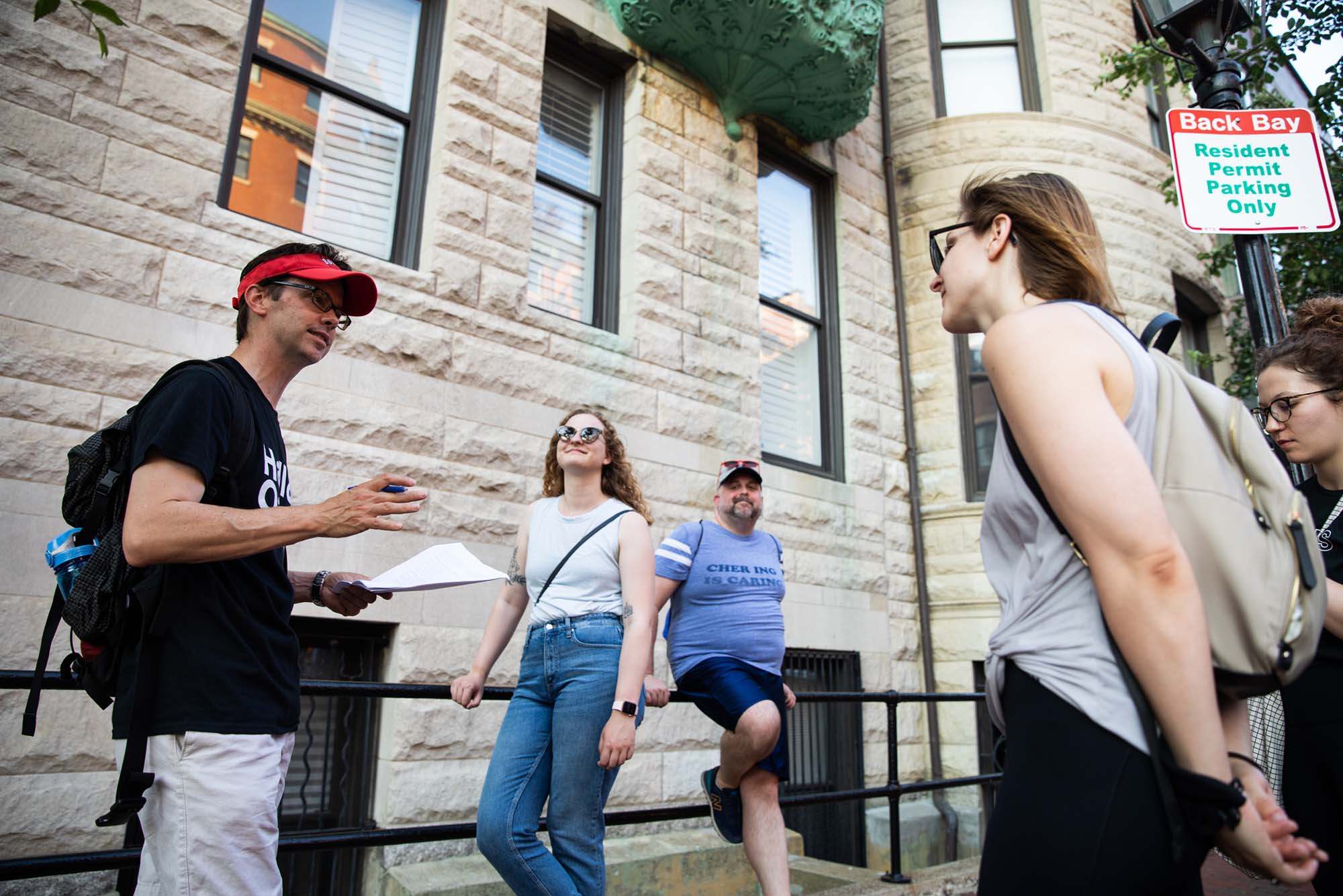 Photo: Daryl Healea (left) Assistant Dean of College of Arts and Sciences and part time lecturer stops to give his History of Boston University students a brief history lesson on the significance the Back Bay had to the early days of Boston University, from (l-r) Maddy Smalley, graduate student for the Wheelock Education Leadership Policy Studies with the Higher Education Administration