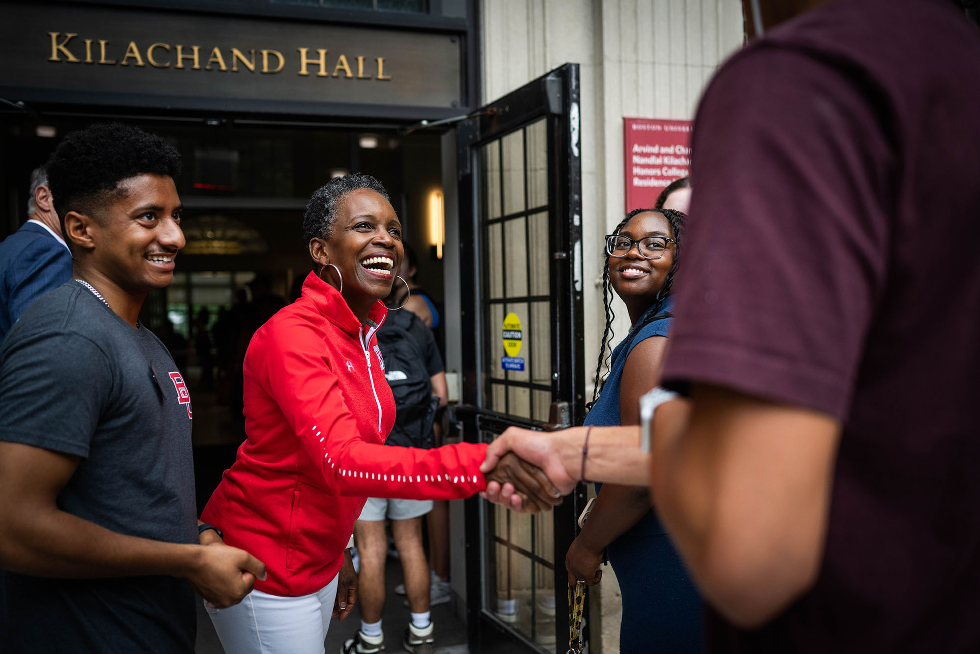 Photo: President Melissa Gilliam greets students and parents as they move into Kilachand Hall