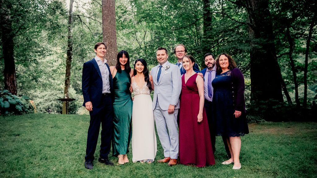 Photo: A group of people in elegant dress at what appears to be a wedding