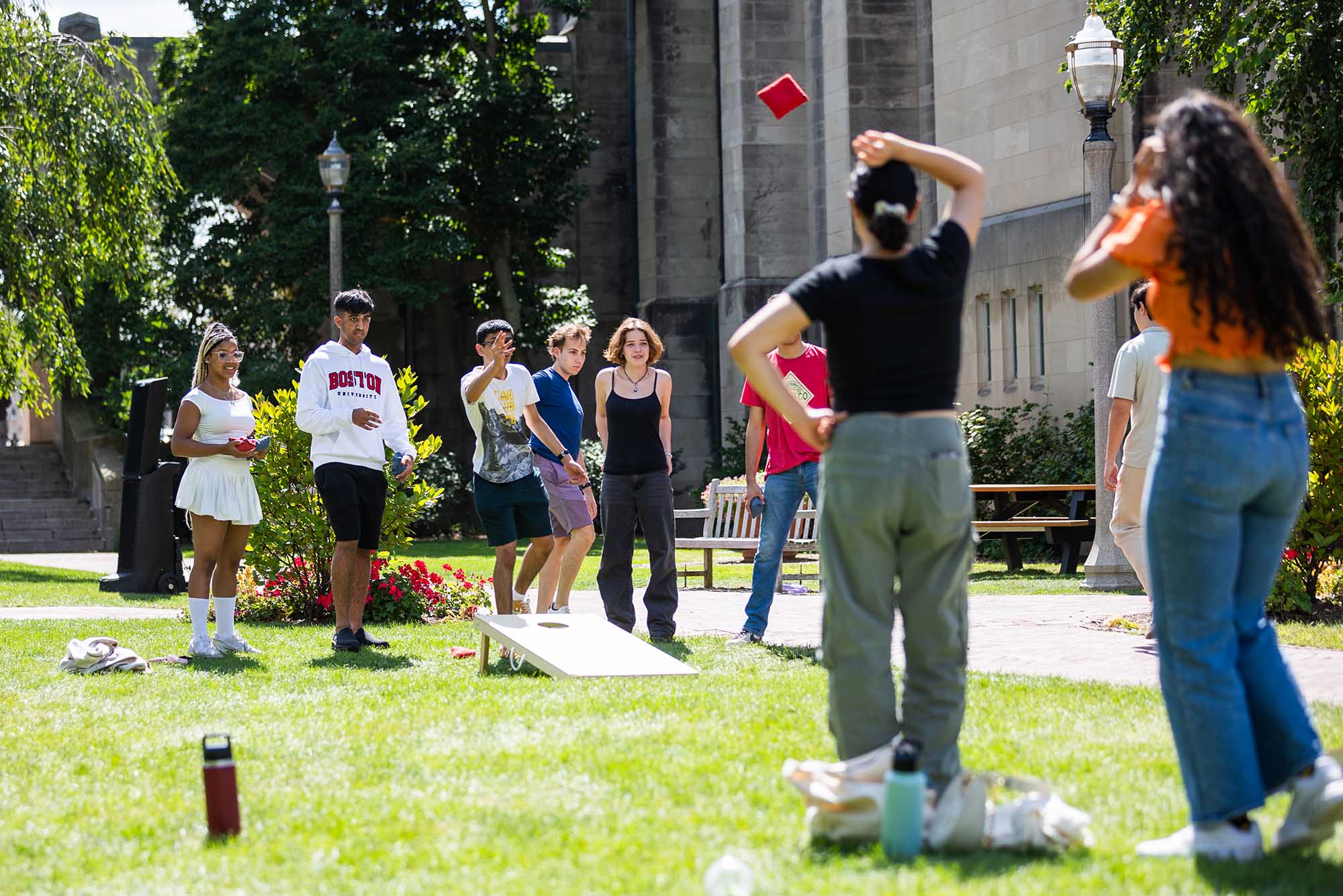 Students play cornhole at the “Welcome Picnic" for BU undergrads hosted by BU's Student Activities Office as part of its annual "Weeks of Welcome" programming, featuring free food and lawn games on the BU Beach.