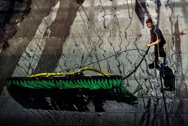 Photo: Dylan Briggs of Jack’s Services washes the windows of the CDS building