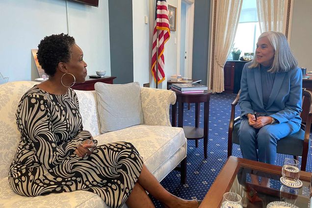 Photo: BU President Melissa L. Gilliam, a black woman with short hair wearing a patterned dress, (left) meets with House Minority Whip Katherine Clark, a white woman with shoulder length hair wearing a blue suit, (D-MA) during a visit to Washington, D.C