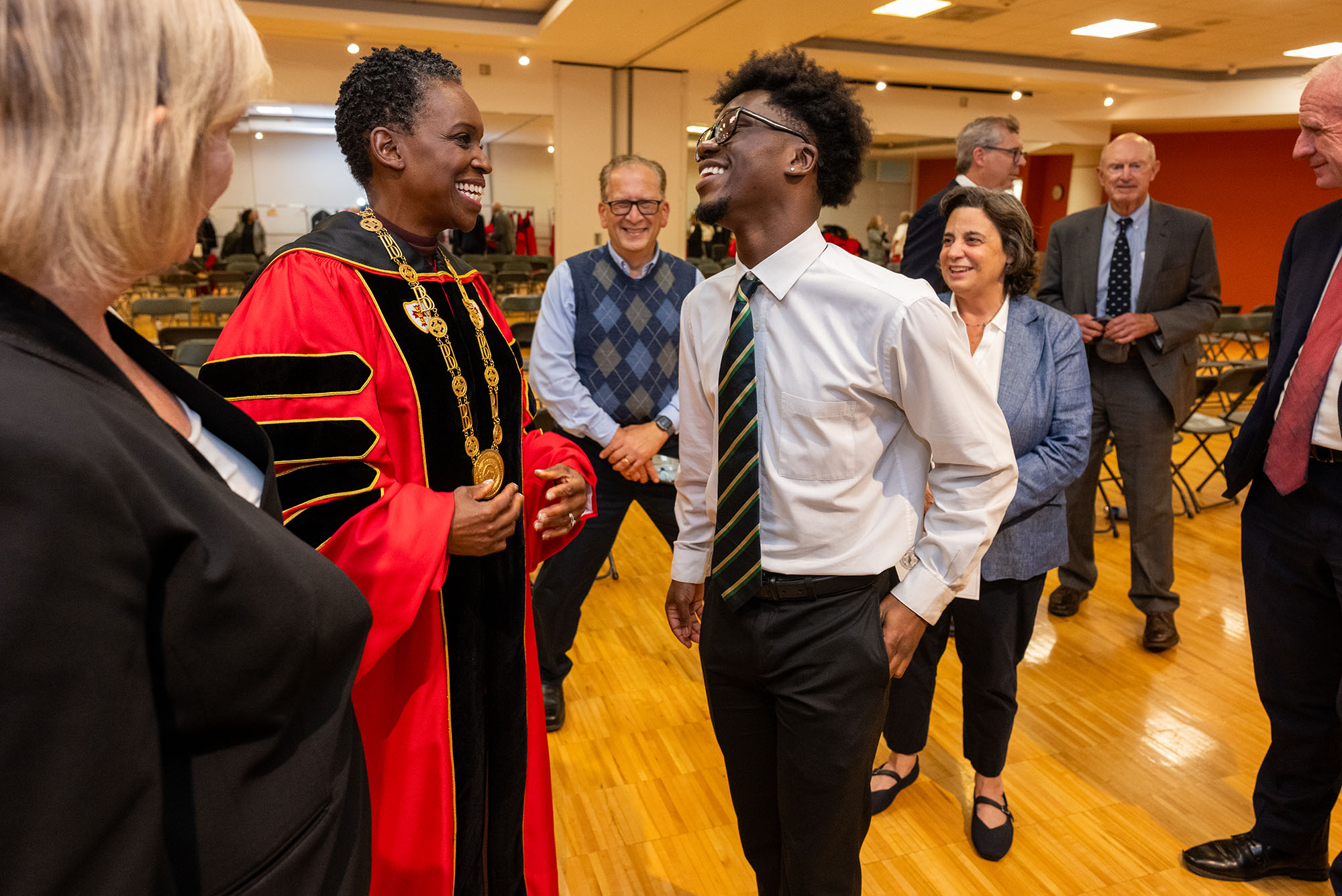 Photo: BU President Melissa Gilliam (left) and BU Student Government President Akwasi Antwi talking behind the scenes at her inauguration
