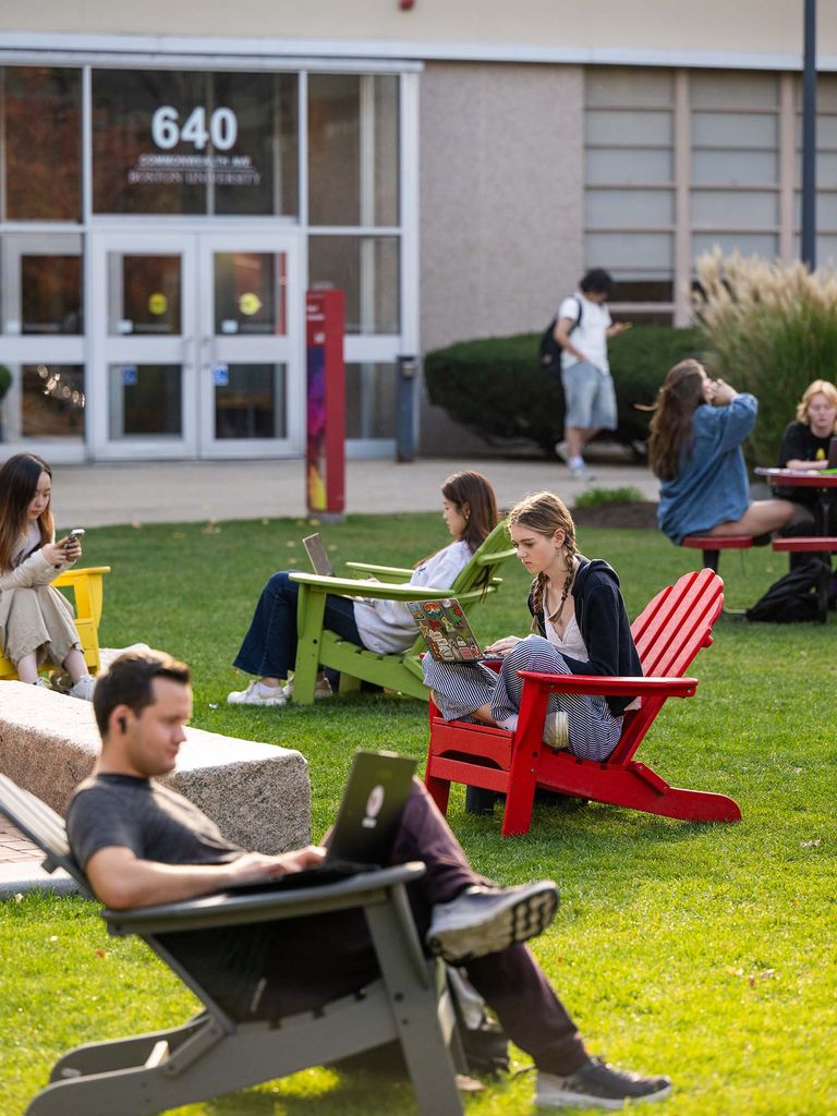 Photo: BU Students on COM Lawn studying on lawn chairs