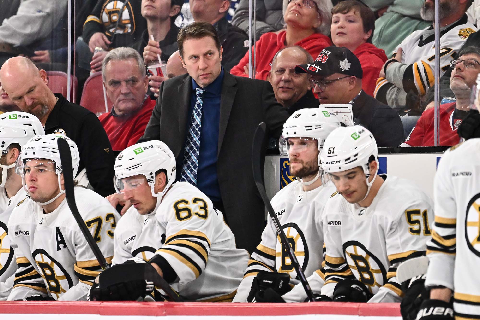 Photo: Joe Sacco with the Boston Bruins on the sideline during a game