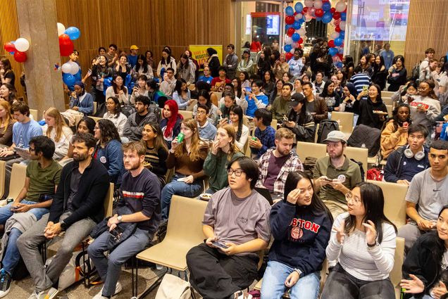 Photo: A large crowd of students at a BU election watch party